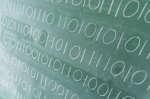 Binary code on blackboard.