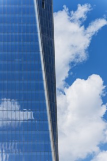 USA, New York City, Sky reflecting in World Trade Tower windows.