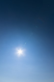 Clear blue sky and solar flare.
