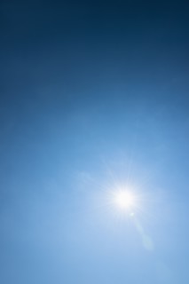Clear blue sky and solar flare.