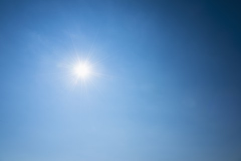 Clear blue sky and solar flare.