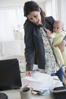 Mother with baby boy (2-5 months) working from home. Photo: Jamie Grill