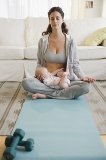 Mother and baby boy (2-5 months) practicing yoga. Photo : Jamie Grill
