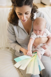 Mother and baby boy (2-5 months) checking colors samples. Photo: Jamie Grill