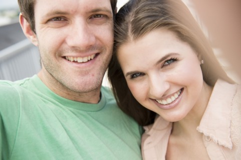 Portrait of happy young couple . Photo : Jamie Grill