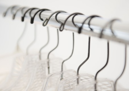 Coat hangers on clothes rack. Photo : Jamie Grill