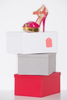 Studio shot of dress shoe on top of stack of boxes. Photo : Daniel Grill