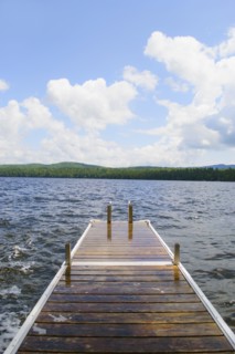 View of lake with wooden jetty. Photo : Daniel Grill