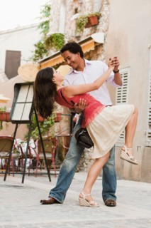 France, Cassis, Couple dancing on street. Photo: Mike Kemp