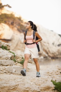 France, Marseille, Woman hiking in rocky terrain. Photo : Mike Kemp