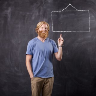 Man in front of blackboard with drawing depicting blank square. Photo : Jessica Peterson