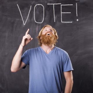 Man in front of blackboard. Photo: Jessica Peterson