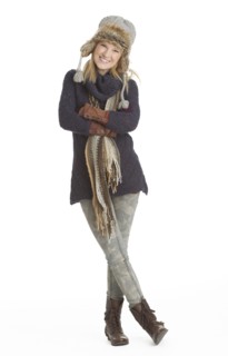 Portrait of woman smiling, studio shot.