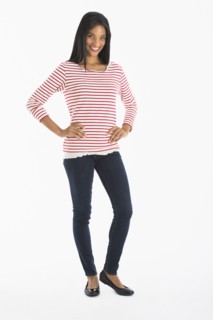 Portrait of woman smiling, studio shot.