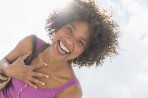 Portrait of woman laughing.