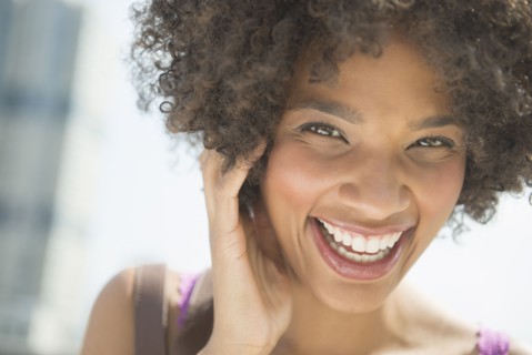Portrait of woman laughing.