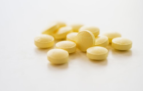 Yellow pills, studio shot.
