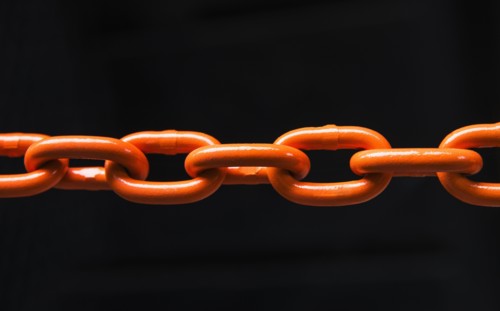 Chain on black background, studio shot.