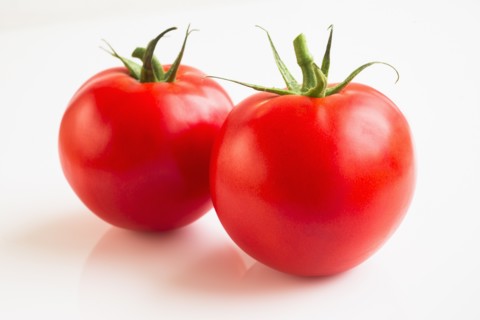 Tomatoes on white background, studio shot.