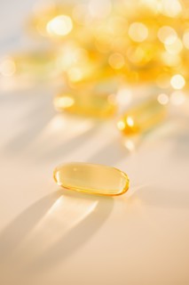 Omega fatty acid pills on white background, studio shot.