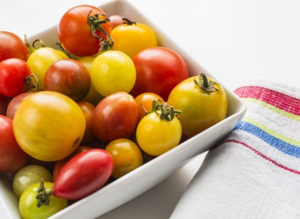 Heirloom tomatoes in plate, studio shot.