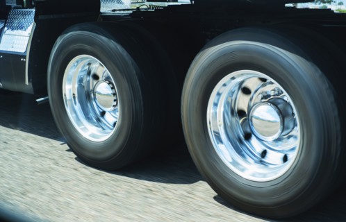 Wheels of truck in motion.