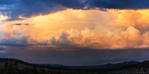 Clouds above valley at dusk.