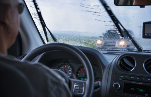 Man driving in rain.