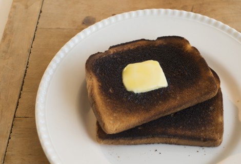 Burnt toasts on plate.