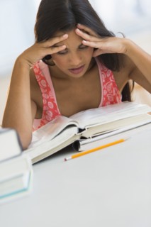 Female student reading book.