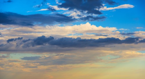 Sunset light on cloudy sky.