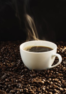 Hot coffee and coffee beans, studio shot.