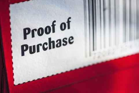 Close up of proof of purchase with bar code, studio shot.