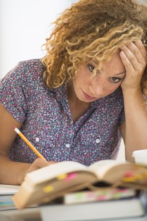 Young woman studying in library.