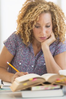 Young woman studying in library.