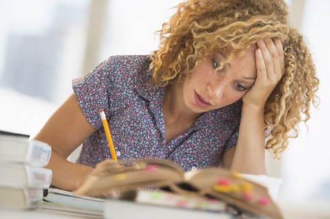 Young woman studying in library.