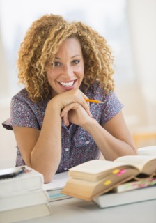 Young woman studying in library.