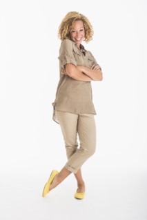 Portrait of smiling young woman, studio shot.