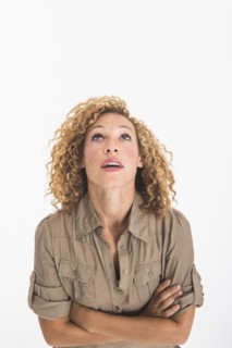 Portrait of young woman on white background, studio shot.