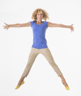 Woman jumping, studio shot.