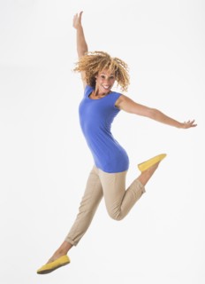 Woman jumping, studio shot.