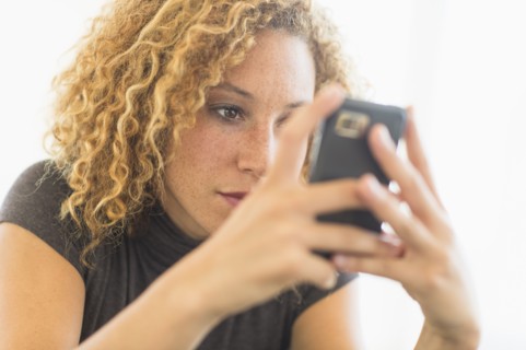 Businesswoman using smart phone.