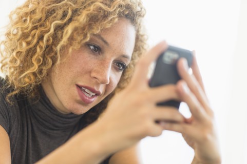 Businesswoman using smart phone.