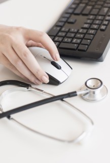 Doctor using computer.