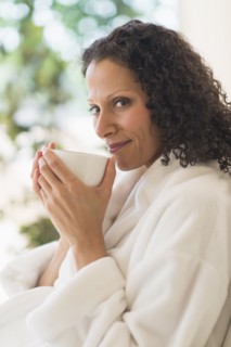 Woman relaxing with cup of coffee.