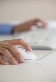 Human hand with computer mouse.