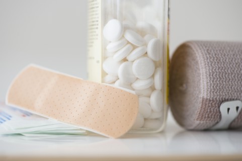 Studio shot of pills, bandage and adhesive bandage. Photo : Jamie Grill