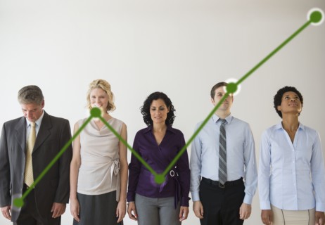 Office workers and green graph. Photo : Jamie Grill