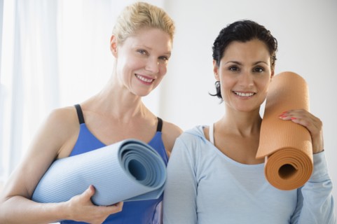 Female friends prepared for yoga class. Photo : Jamie Grill