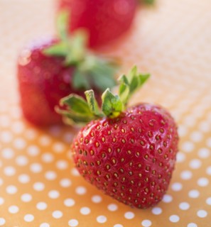 Close-up of strawberries on dotted background. Photo: Daniel Grill